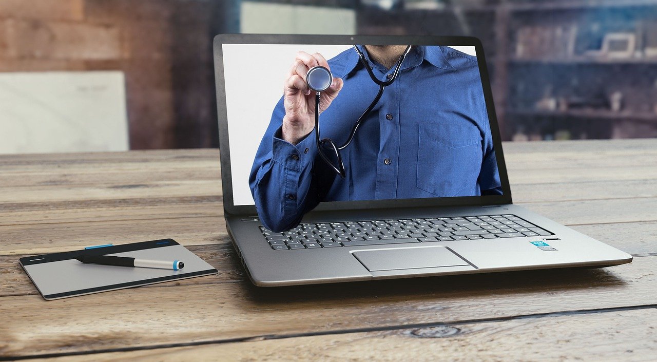 image of doctor on computer screen telehealth